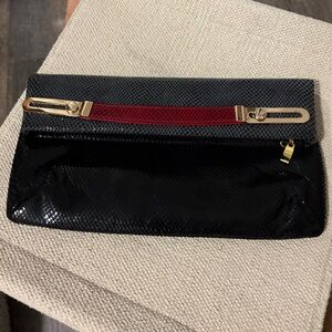 Miss Mak Chic Black Patent Clutch with Red Accent Strap and grey